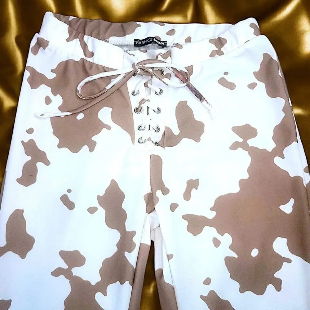 Fashion Nova brown white cow pattern flare pants